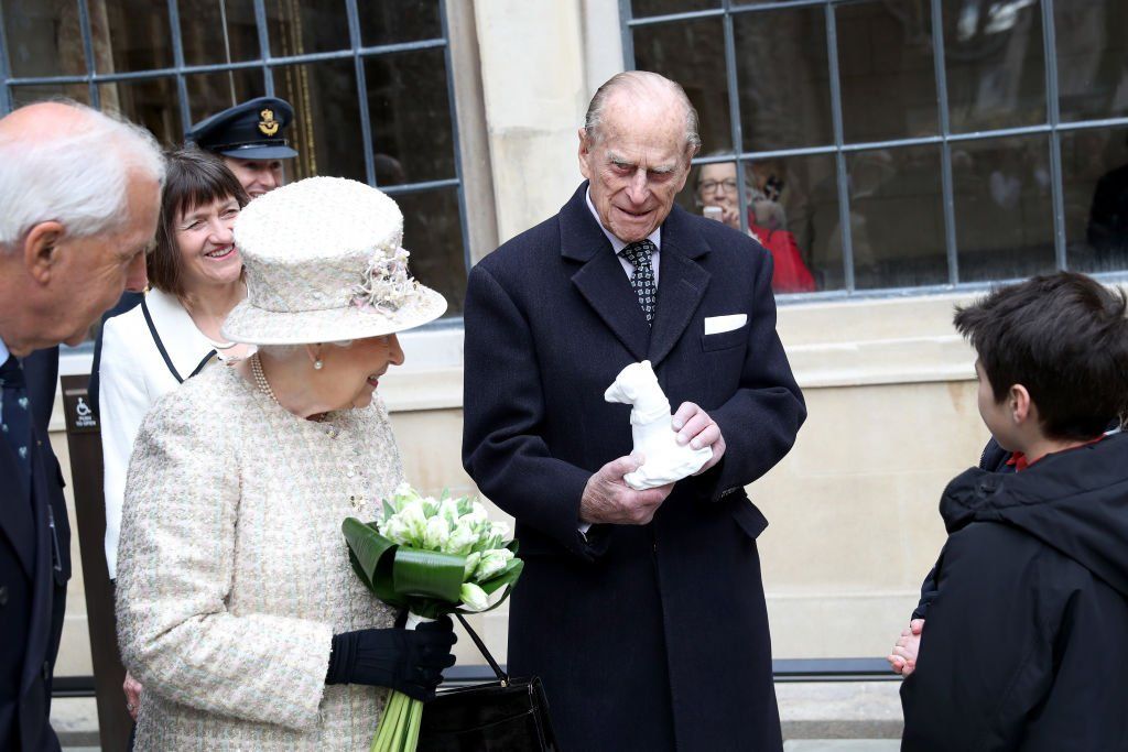 Queen Elizabeth II and Prince Philip, Duke of Edinburgh are greeted by local school children as they open a new development at The Charterhouse at Charterhouse Square on February 28, 2017 | Photo: Getty Images
