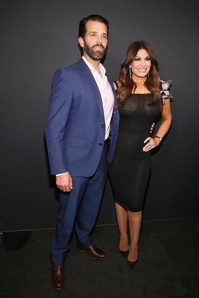 Kimberly Guilfoyle and Donald Trump Jr. pose backstage for Zang Toi fashion show during New York Fashion Week: The Shows at Gallery II at Spring Studios on February 13, 2019 in New York City | Photo: Getty Images