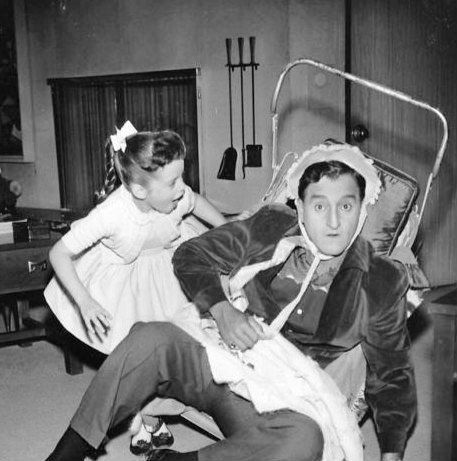 Danny Thomas and his television daughter, Angela Cartwright, play house in this publicity photo from the television program 