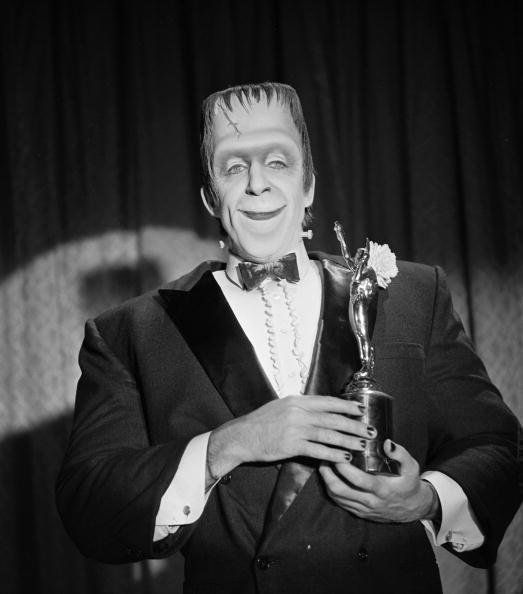 Herman Munster with an award trophy in a still from the CBS television situation comedy 